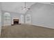 Open living room featuring vaulted ceilings, fireplace, and neutral color palette at 3946 Village Crossing Ln, Ellenwood, GA 30294