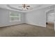 Comfortable bedroom features neutral walls, carpeted floors, and a ceiling fan at 3946 Village Crossing Ln, Ellenwood, GA 30294