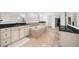 Large bathroom featuring separate vanities with black countertops and a soaking tub at 4435 Manor Creek Dr, Cumming, GA 30040