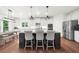 Bright kitchen features an island with barstool seating and stainless steel appliances at 4435 Manor Creek Dr, Cumming, GA 30040