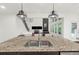 Close-up of the kitchen island with granite countertops, stainless steel sink, and pendant lighting at 4435 Manor Creek Dr, Cumming, GA 30040