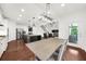 Open concept kitchen connects seamlessly to the living area, perfect for modern living at 4435 Manor Creek Dr, Cumming, GA 30040