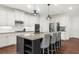 Kitchen island with barstool seating, stainless appliances, and white cabinets at 4435 Manor Creek Dr, Cumming, GA 30040