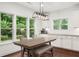 Bright breakfast nook features natural light and wood floors at 4435 Manor Creek Dr, Cumming, GA 30040
