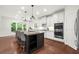 White cabinets, stainless appliances, and a kitchen island with seating at 4435 Manor Creek Dr, Cumming, GA 30040