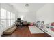 Bright office with hardwood floors, built-in shelves, and large windows with shutter blinds at 4435 Manor Creek Dr, Cumming, GA 30040