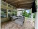 Inviting covered patio featuring comfortable seating and a ceiling fan, ideal for outdoor relaxation at 4435 Manor Creek Dr, Cumming, GA 30040