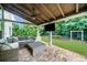 Outdoor patio with a comfortable sectional sofa and ceiling fan, perfect for relaxing and entertaining at 4435 Manor Creek Dr, Cumming, GA 30040