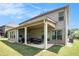 Brick home with a covered patio, perfect for relaxing and outdoor entertaining at 6861 Louis Dr, Locust Grove, GA 30248