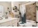 Well-lit bathroom features a shower-tub combo and attractive decor at 6861 Louis Dr, Locust Grove, GA 30248