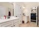 Shared bathroom with double vanity, stone countertops, and ample storage at 6861 Louis Dr, Locust Grove, GA 30248