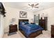 Comfortable bedroom featuring a ceiling fan and furnishings at 6861 Louis Dr, Locust Grove, GA 30248