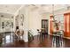 Elegant dining space adjacent to the foyer, featuring hardwood floors, coffered ceilings and stylish furniture at 6861 Louis Dr, Locust Grove, GA 30248