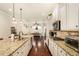Bright kitchen featuring granite countertops, stainless steel appliances, and a large island at 6861 Louis Dr, Locust Grove, GA 30248