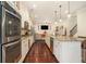 Modern kitchen with stainless steel appliances, granite counters, and open layout at 6861 Louis Dr, Locust Grove, GA 30248