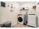 Functional laundry room equipped with modern appliances and storage shelves at 6861 Louis Dr, Locust Grove, GA 30248