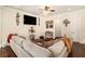 Cozy living room showcasing stylish decor, hardwood floors, and a comfortable sectional sofa at 6861 Louis Dr, Locust Grove, GA 30248