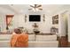 Comfortable living room with a large sectional sofa, hardwood floors, and stylish decorative accents at 6861 Louis Dr, Locust Grove, GA 30248