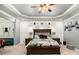 Large main bedroom featuring a stylish king bed, decor, and ample natural light at 6861 Louis Dr, Locust Grove, GA 30248
