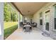 Covered patio with brick columns offers an outdoor seating area and backyard views at 6861 Louis Dr, Locust Grove, GA 30248