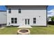 Backyard featuring an outdoor fire pit, a concrete patio and french doors at 522 Evans Ln, Woodstock, GA 30188