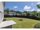 Backyard featuring a fire pit, a concrete patio, and a fence at 522 Evans Ln, Woodstock, GA 30188