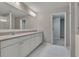 Bright bathroom featuring double sinks, white cabinetry and tile floors at 522 Evans Ln, Woodstock, GA 30188