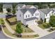 View of a two-story home showing manicured lawn, landscaping, a driveway and a two-car garage at 522 Evans Ln, Woodstock, GA 30188