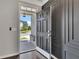 Inviting front door view showcasing the home's entryway, exterior finishes, and view of the lawn and street at 522 Evans Ln, Woodstock, GA 30188