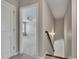 Hallway features a view of a room with carpet and a ceiling fan at 522 Evans Ln, Woodstock, GA 30188