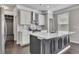 Modern kitchen featuring gray island, stainless steel appliances, and sleek countertops at 522 Evans Ln, Woodstock, GA 30188