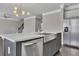 Modern kitchen showcasing large island with sink, stainless steel appliances, and sleek countertops at 522 Evans Ln, Woodstock, GA 30188