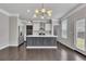 Modern kitchen with an island, stainless steel appliances, and stylish lighting at 522 Evans Ln, Woodstock, GA 30188