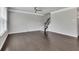 Spacious living room featuring hardwood floors, modern ceiling fan and natural light at 522 Evans Ln, Woodstock, GA 30188