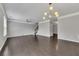 Open-concept living room with hardwood floors, modern lighting, staircase and natural light at 522 Evans Ln, Woodstock, GA 30188