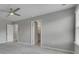 Large main bedroom featuring a ceiling fan and a hallway to the bathroom at 522 Evans Ln, Woodstock, GA 30188