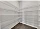 Walk-in pantry featuring wire shelving for optimal storage, and hardwood floors at 522 Evans Ln, Woodstock, GA 30188