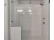 Modern shower with white tile and glass door at 522 Evans Ln, Woodstock, GA 30188