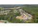 An aerial shot of a neighborhood featuring newly built homes surrounded by lush, mature trees at 863 N Bay Overlook, Villa Rica, GA 30180