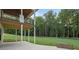 A covered patio provides an ideal vantage point to enjoy the lush backyard and wooded scenery at 863 N Bay Overlook, Villa Rica, GA 30180