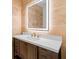 Modern bathroom with stone wall, vanity with stone countertop, and illuminated mirror at 863 N Bay Overlook, Villa Rica, GA 30180