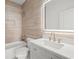 Bathroom featuring a shower and tub combination, light tile, and a lighted mirror at 863 N Bay Overlook, Villa Rica, GA 30180