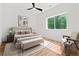 Bright bedroom featuring a ceiling fan, large window, and a stylish neutral-toned decor at 863 N Bay Overlook, Villa Rica, GA 30180