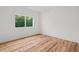 Bedroom with hardwood flooring, large window, and white walls at 863 N Bay Overlook, Villa Rica, GA 30180