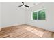 Bright bedroom with hardwood flooring, large window, and white walls at 863 N Bay Overlook, Villa Rica, GA 30180