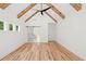 Bright bedroom featuring vaulted ceiling with wood beams and a sliding barn door at 863 N Bay Overlook, Villa Rica, GA 30180