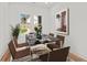 Dining room features modern table set, natural light, and view of backyard at 863 N Bay Overlook, Villa Rica, GA 30180