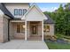 Welcoming entrance of a brick home featuring modern architectural details and manicured landscaping at 863 N Bay Overlook, Villa Rica, GA 30180