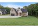 Charming brick home with a three-car garage and well-manicured front lawn at 863 N Bay Overlook, Villa Rica, GA 30180