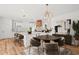 Open kitchen featuring a large center island, custom cabinetry, and a dining area at 863 N Bay Overlook, Villa Rica, GA 30180